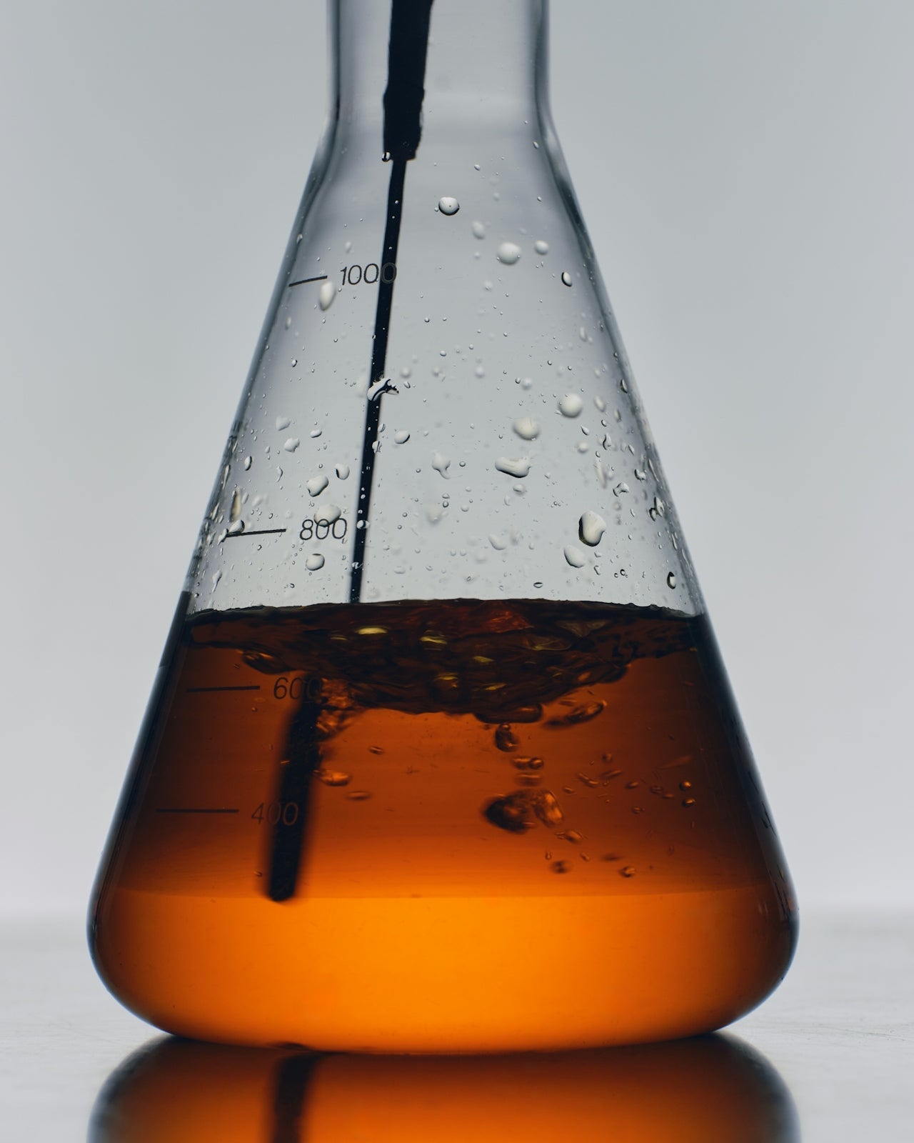 a beaker of acid in a lab setting for skincare